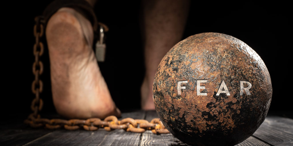 Ball and shackle with 'Fear' written on it