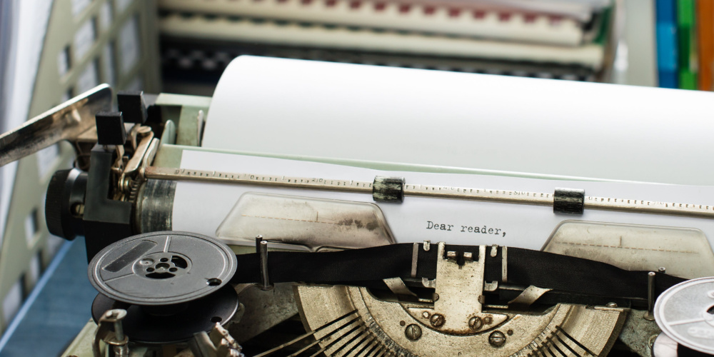 A typewriter with paper
